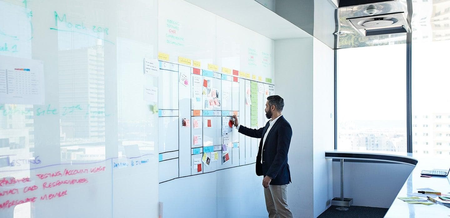 A Trivyun HR consultant mapping out a search strategy on a planning board.