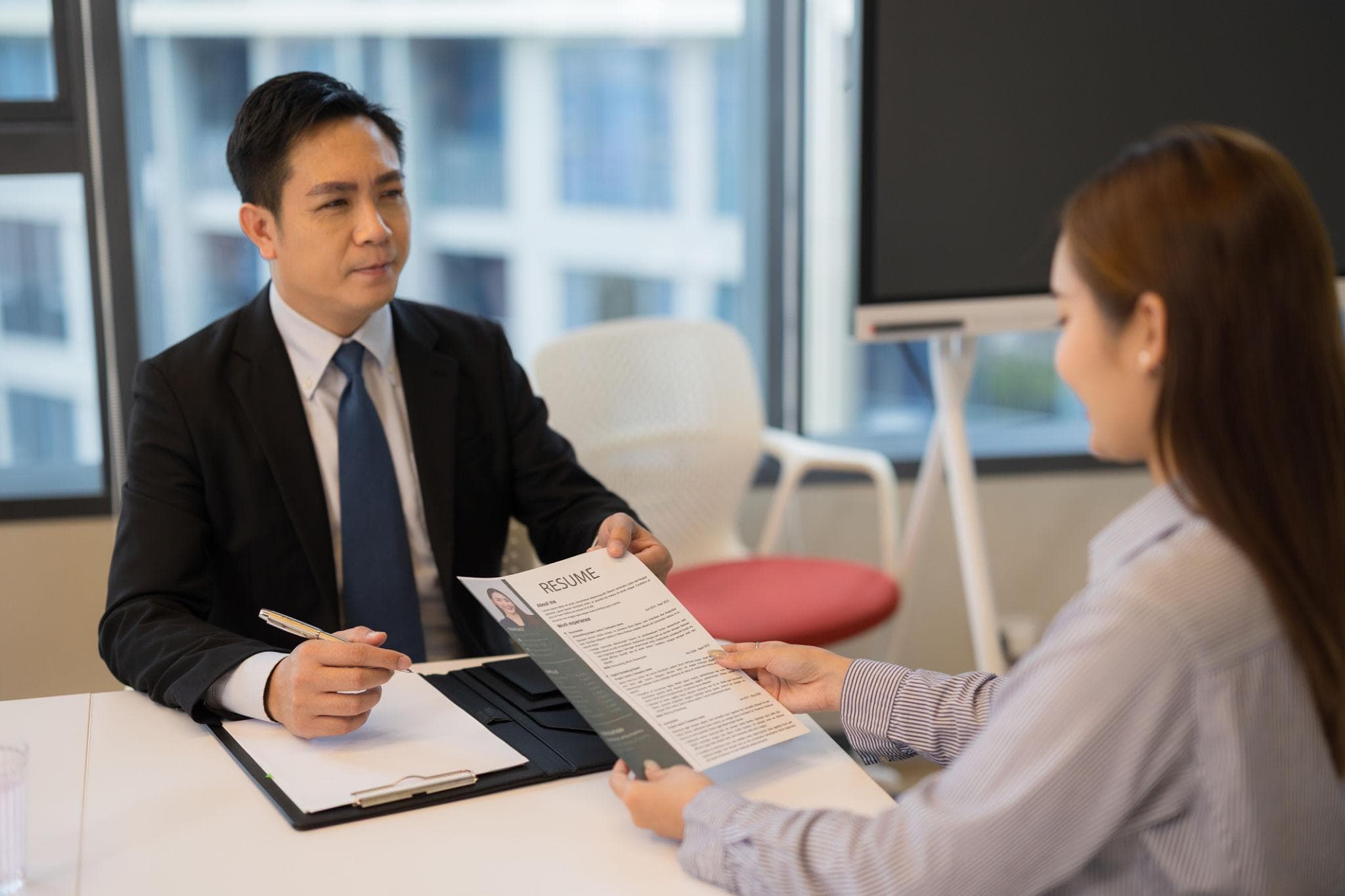 A recruiter discussing a candidate's application in an interview.